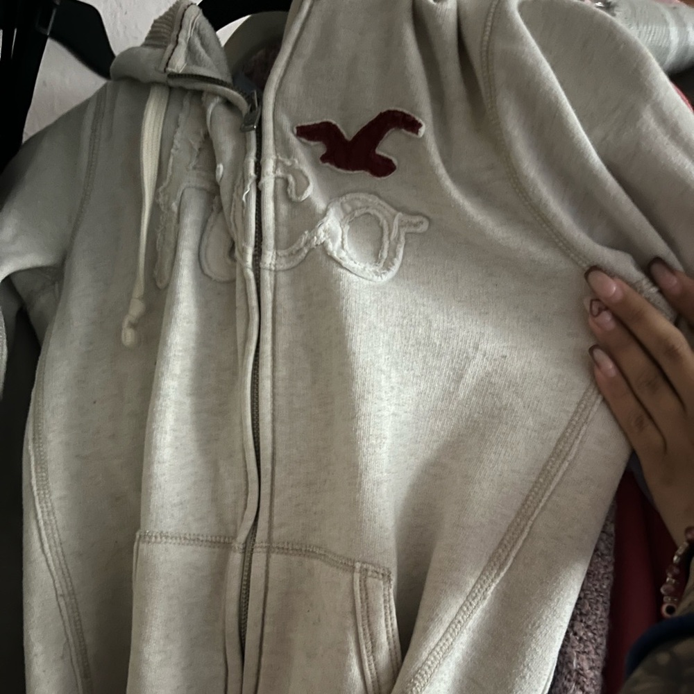 Hollister Beige Hoodie with Maroon Emblem